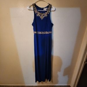 Floor length blue prom dress. Small slit up to knee. Sheer waistline. Size 12.